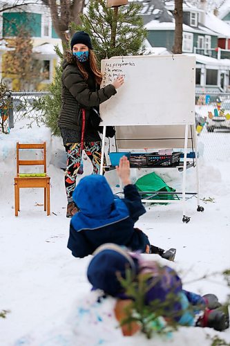 Laura Secord School teacher Ellen Lamont holds an outdoor science class at the school in Winnipeg Wednesday, January 20, 2022. Lamont has been taking her early years students outside as much as possible this year, as she embraces the benefits of outdoor education while choosing a safer mid-pandemic teaching alternative to a indoor classroom. Lamont and her class have built a snow classroom outside the Wolseley school. 

Reporter: Macintosh