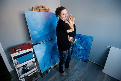 JOHN WOODS / WINNIPEG FREE PRESS
Jordan Miller, executive director of Cre8ery Gallery and Studio and artist, and her cat Jackson are photographed and reacts to Manitobas relaxing of COVID-19 restrictions in a home in St. Andrews Thursday, January 21, 2021. Miller says she likely wont have any extra people over.

Reporter: Abas