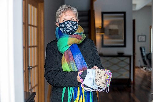 MIKAELA MACKENZIE / WINNIPEG FREE PRESS

Sharon Erickson-Nesmith poses with some of her hand-sewn masks at her home in Winnipeg on Friday, Jan. 22, 2021. For Brenda Suderman story.

Winnipeg Free Press 2021