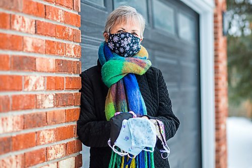 MIKAELA MACKENZIE / WINNIPEG FREE PRESS

Sharon Erickson-Nesmith poses with some of her hand-sewn masks at her home in Winnipeg on Friday, Jan. 22, 2021. For Brenda Suderman story.

Winnipeg Free Press 2021