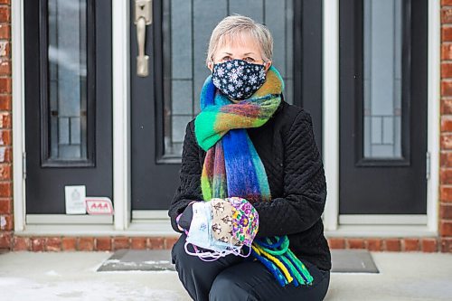 MIKAELA MACKENZIE / WINNIPEG FREE PRESS

Sharon Erickson-Nesmith poses with some of her hand-sewn masks at her home in Winnipeg on Friday, Jan. 22, 2021. For Brenda Suderman story.

Winnipeg Free Press 2021