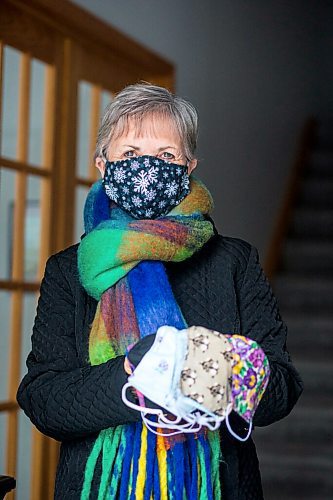 MIKAELA MACKENZIE / WINNIPEG FREE PRESS

Sharon Erickson-Nesmith poses with some of her hand-sewn masks at her home in Winnipeg on Friday, Jan. 22, 2021. For Brenda Suderman story.

Winnipeg Free Press 2021