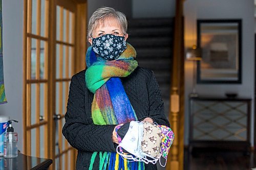 MIKAELA MACKENZIE / WINNIPEG FREE PRESS

Sharon Erickson-Nesmith poses with some of her hand-sewn masks at her home in Winnipeg on Friday, Jan. 22, 2021. For Brenda Suderman story.

Winnipeg Free Press 2021