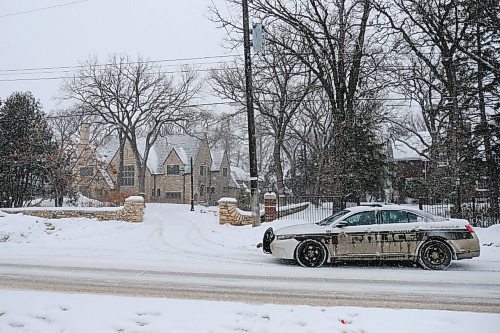 Daniel Crump / Winnipeg Free Press. A police cruiser sits outside Brian Pallisters wellington crescent mansion. At least a dozen police vehicles were in the area early Saturday afternoon.  January 23, 2021.