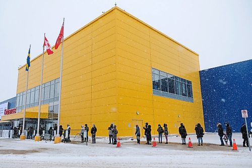 Daniel Crump / Winnipeg Free Press. The line of customers snakes around the corner at IKEA on the first day of eased shopping restrictions. January 23, 2021.