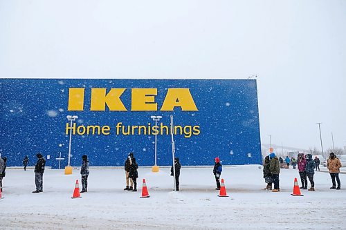 Daniel Crump / Winnipeg Free Press. The line of customers snakes around the corner at IKEA on the first day of eased shopping restrictions. January 23, 2021.