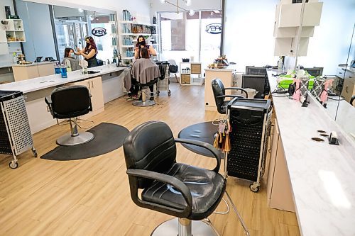 Daniel Crump / Winnipeg Free Press. Tara Roberts (left) gets a haircut from Sabrina Cornwell (right) at Hairplay Salon on Ness Avenue. With some COVID restrictions easing hair salons and barbershops can now open at 25% capacity. January 23, 2021.