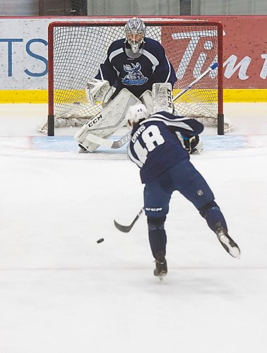 MIKE DEAL / WINNIPEG FREE PRESS
Manitoba Moose goaltender Cole Kehler (31) prepares to stop a shot by Brett Davis (48) during training camp at BellMTS Iceplex Monday afternoon.
210125 - Monday, January 25, 2021.