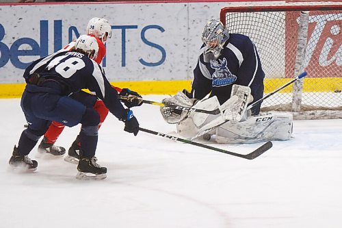 MIKE DEAL / WINNIPEG FREE PRESS
Manitoba Moose goaltender Cole Kehler (31) stops the puck with his pads during training camp at BellMTS Iceplex Monday afternoon.
210125 - Monday, January 25, 2021.