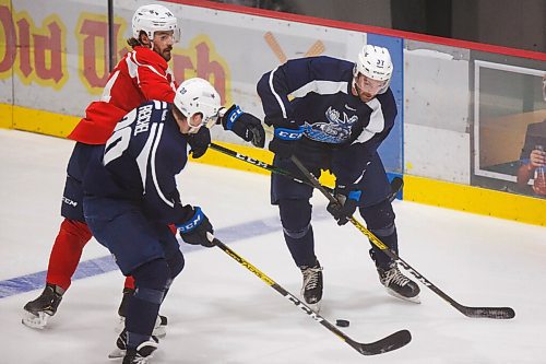 MIKE DEAL / WINNIPEG FREE PRESS
Manitoba Moose Jimmy Oligny (14), Kristian Reichel (20), and Brent Pedersen (37) during training camp at BellMTS Iceplex Monday afternoon.
210125 - Monday, January 25, 2021.