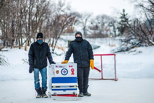 MIKAELA MACKENZIE / WINNIPEG FREE PRESS

Ron (left) and Anthony Thierault pose for a photo with their washing machine zamboni on the Seine River near Marion Street in Winnipeg on Monday, Jan. 25, 2021. For JS story.

Winnipeg Free Press 2021