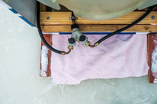 MIKAELA MACKENZIE / WINNIPEG FREE PRESS

Ron and Anthony Thierault's washing machine zamboni on the Seine River near Marion Street in Winnipeg on Monday, Jan. 25, 2021. For JS story.

Winnipeg Free Press 2021