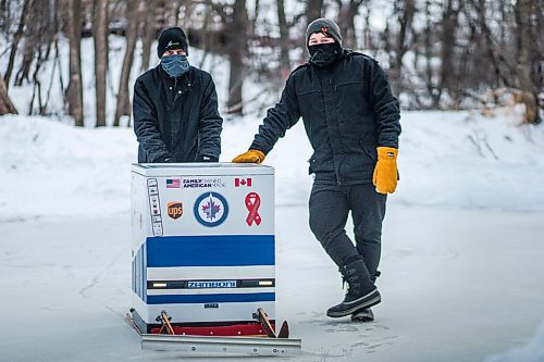 MIKAELA MACKENZIE / WINNIPEG FREE PRESS

Ron (left) and Anthony Thierault pose for a photo with their washing machine zamboni on the Seine River near Marion Street in Winnipeg on Monday, Jan. 25, 2021. For JS story.

Winnipeg Free Press 2021