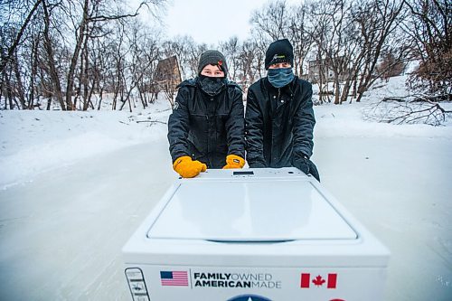 MIKAELA MACKENZIE / WINNIPEG FREE PRESS

Anthony (left) and Ron Thierault pose for a photo pushing their washing machine zamboni on the Seine River near Marion Street in Winnipeg on Monday, Jan. 25, 2021. For JS story.

Winnipeg Free Press 2021