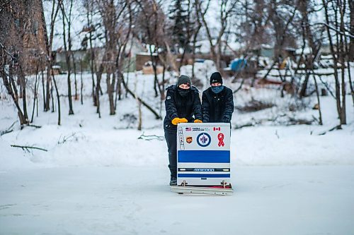 MIKAELA MACKENZIE / WINNIPEG FREE PRESS

Anthony (left) and Ron Thierault pose for a photo pushing their washing machine zamboni on the Seine River near Marion Street in Winnipeg on Monday, Jan. 25, 2021. For JS story.

Winnipeg Free Press 2021