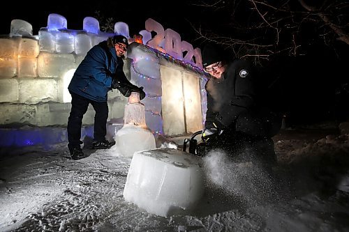 JOHN WOODS / WINNIPEG FREE PRESS
Dave Robinson, left, and his son Stephen have built a 40 by 8 foot ice castle in their North Kildonan front yard in Winnipeg Monday, January 25, 2021. 

Reporter: ?