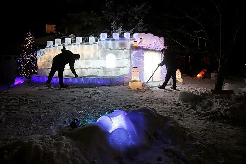 JOHN WOODS / WINNIPEG FREE PRESS
David Robinson, right, and his son Stephen have built a 40 by 8 foot ice castle in their North Kildonan front yard in Winnipeg Monday, January 25, 2021. 

Reporter: ?