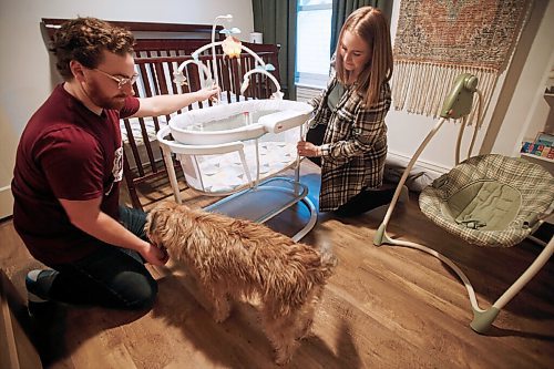 JOHN WOODS / WINNIPEG FREE PRESS
Rory and Lisa McDonald and Ozzie are photographed at their home in Winnipeg Wednesday, January 27, 2021. The MacDonalds are expecting their baby by surrogate during the pandemic.

Reporter: Jen