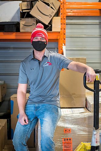 MIKAELA MACKENZIE / WINNIPEG FREE PRESS

Trevor Froese, owner of Runnin' Red, poses for a portrait in one of their warehouses in Emerson, Manitoba on Wednesday, Jan. 27, 2021. For JS story.

Winnipeg Free Press 2021