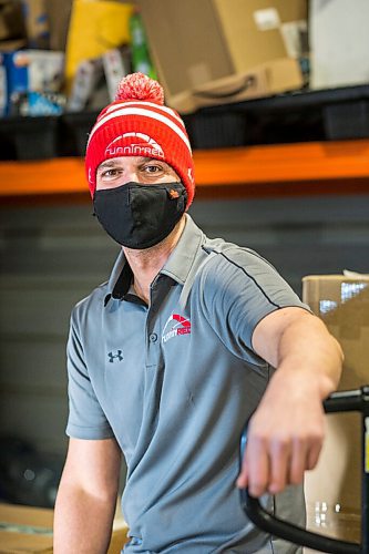 MIKAELA MACKENZIE / WINNIPEG FREE PRESS

Trevor Froese, owner of Runnin' Red, poses for a portrait in one of their warehouses in Emerson, Manitoba on Wednesday, Jan. 27, 2021. For JS story.

Winnipeg Free Press 2021