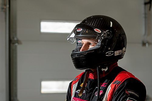 MIKE SUDOMA / WINNIPEG FREE PRESS
Race Car Driver, Damon Surzyshyn puts on his racing helmet as he chats about racing during the pandemic in his garage Thursday afternoon
January 28, 2021