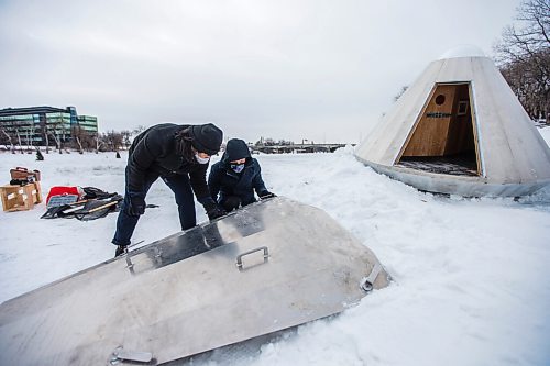 MIKAELA MACKENZIE / WINNIPEG FREE PRESS

Steven Hung (left) and Sean Radford, part of the AtLRG Architecture team, put the finishing touches on the Hot Landing warming hut at the unveiling at The Forks in Winnipeg on Friday, Jan. 29, 2021. For Al Small story.

Winnipeg Free Press 2021