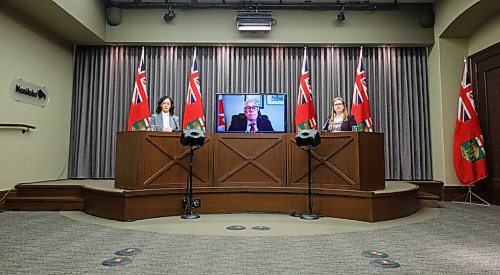 MIKE DEAL / WINNIPEG FREE PRESS
Conservation and Climate Minister Sarah Guillemard (right) and Colleen Kuruluk, chief executive officer, Efficiency Manitoba (left) flank a virtual Jim Carr, special representative for the Prairies, and member of Parliament, Winnipeg South Centre, while he announces the Canadian government will be putting forward approximately $32.3 million from the Low Carbon Economy Leadership Fund to support natural gas reduction programs offered by Efficiency Manitoba, a new Crown corporation established by the government of Manitoba.
210129 - Friday, January 29, 2021.