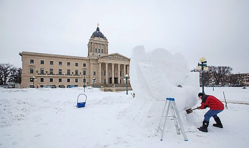 MIKE DEAL / WINNIPEG FREE PRESS
Gary Tessier works diligently on a snow sculpture on the grounds of the Manitoba Legislative building that commemorates frontline healthcare workers. The sculpture is one of many that will be created over the next few weeks for the upcoming Festival du Voyageur (Feb 12-21).
210129 - Friday, January 29, 2021.