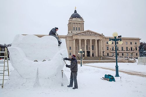 MIKE DEAL / WINNIPEG FREE PRESS
Jacques Boulet (left) and David MacNair (right) work diligently on a snow sculpture on the grounds of the Manitoba Legislative building that commemorates frontline healthcare workers. The sculpture is one of many that will be created over the next few weeks for the upcoming Festival du Voyageur (Feb 12-21).
210129 - Friday, January 29, 2021.