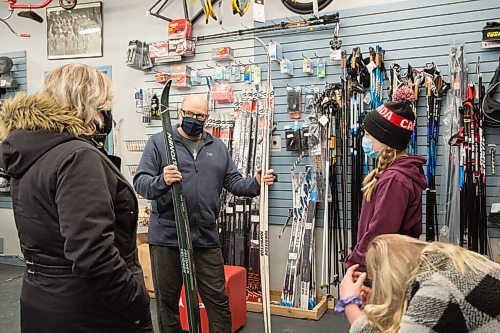 Mike Sudoma / Winnipeg Free Press
Olympia Cycle and Ski owner, Brian Burke help sisters  Karlee Bird, Hayley Bird and their mother, Janice Heritage with a ski/boot fitting Friday afternoon. Janice and her two daughters came in all the way from Elkhorn, Manitoba as their local ski shop is fully sold out of ski supplies.
January 29, 2021