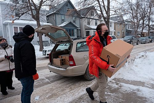 JESSE BOILY  / WINNIPEG FREE PRESS
Brian MacKinnon, Y-Not? Anti-Poverty founder and director, unloads his car as he delivers 50 fitness kits for the students of General Wolfe School to use at home on Friday. Taylor Hunter, a physical education teacher at General Wolfe School, said she plans to give students a tutorial before they are handed out to students. She said, many of the students are missing organized sports and dont have any equipment at home to keep fit and active.  Friday, Jan. 29, 2021. The MacKinnon's Y-Not? Anti-Poverty program aims to promote self-empowerment through sport and recreation to underprivileged youth and families in need.
Reporter:Standup
