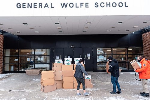 JESSE BOILY  / WINNIPEG FREE PRESS
(Left to right)Taylor Hunter, physical education teacher, Arthur MacKinnon, and Brian MacKinnon, Y-Not? Anti-Poverty founder and director, delivers 50 fitness kits for students of General Wolfe School to use at home on Friday. Taylor Hunter, a physical education teacher at General Wolfe School, said she plans to give students a tutorial before they are handed out to students. She said, many of the students are missing organized sports and dont have any equipment at home to keep fit and active.  Friday, Jan. 29, 2021. The MacKinnon's Y-Not? Anti-Poverty program aims to promote self-empowerment through sport and recreation to underprivileged youth and families in need.
Reporter:Standup
