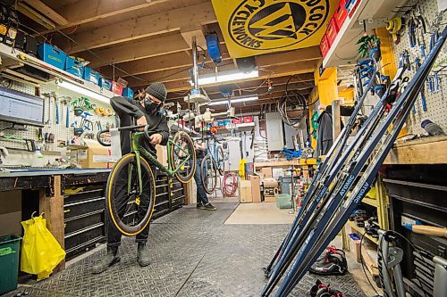 Mike Sudoma / Winnipeg Free Press
Woodcock Cycle Works tech, Charles Darroche, works on a custom built bicycle for a customer Friday afternoon
 January 29, 2021