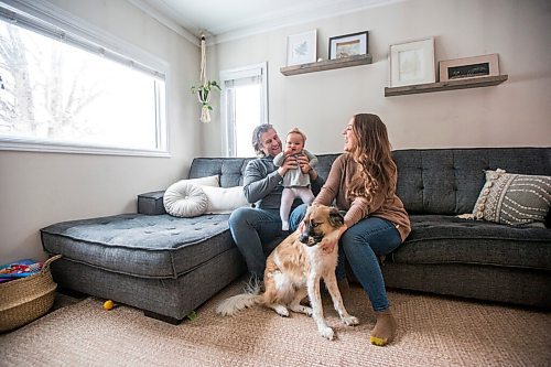 MIKAELA MACKENZIE / WINNIPEG FREE PRESS

Jordan Cieciwa, Tess Klachefsky, and their baby, Betty, pose for a portrait in their home in Winnipeg on Friday, Jan. 29, 2021. For Jen Zoratti story.

Winnipeg Free Press 2021