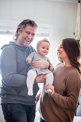 MIKAELA MACKENZIE / WINNIPEG FREE PRESS

Jordan Cieciwa, Tess Klachefsky, and their baby, Betty, pose for a portrait in their home in Winnipeg on Friday, Jan. 29, 2021. For Jen Zoratti story.

Winnipeg Free Press 2021