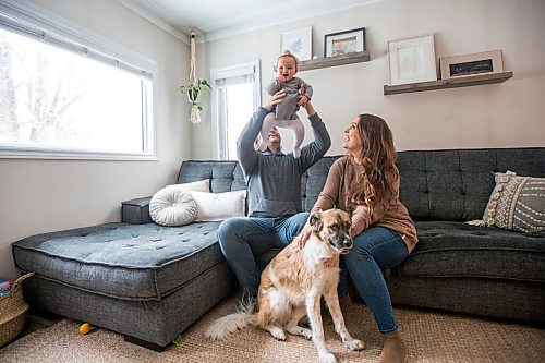 MIKAELA MACKENZIE / WINNIPEG FREE PRESS

Jordan Cieciwa, Tess Klachefsky, and their baby, Betty, pose for a portrait in their home in Winnipeg on Friday, Jan. 29, 2021. For Jen Zoratti story.

Winnipeg Free Press 2021