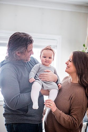 MIKAELA MACKENZIE / WINNIPEG FREE PRESS

Jordan Cieciwa, Tess Klachefsky, and their baby, Betty, pose for a portrait in their home in Winnipeg on Friday, Jan. 29, 2021. For Jen Zoratti story.

Winnipeg Free Press 2021