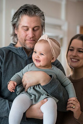 MIKAELA MACKENZIE / WINNIPEG FREE PRESS

Jordan Cieciwa, Tess Klachefsky, and their baby, Betty, pose for a portrait in their home in Winnipeg on Friday, Jan. 29, 2021. For Jen Zoratti story.

Winnipeg Free Press 2021