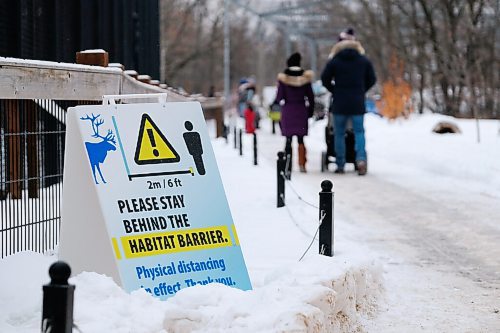 Daniel Crump / Winnipeg Free Press. The Winnipeg Zoo is open for the first time since COVID restrictions we tightened late last year. Signs like the one pictured here help remind visitors to stay safe to help prevent the spread of the coronavirus. January 30, 2021.