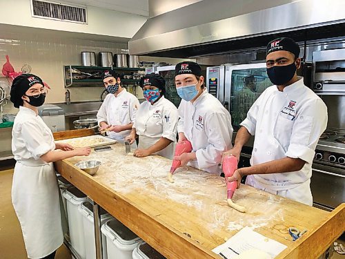 Canstar Community News (From left) Eden Solvason, Mason Kamal, Kim Hibbert, Ben Anderson and Sajanpreet Dhaliwal are students in the culinary arts program at the Louis Riel Arts and Technology Centre.