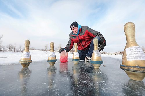 RUTH BONNEVILLE / WINNIPEG FREE PRESS 

ENT Health Column - Coronation Bowling Centre 

Jim Llewellyn, owner of Coronation Bowling Centre, throws milk jug down the ice toward pins Tuesday.  His business has been closed with restrictions so Jim built an ice bowling lane in his community on the lake in Island Lakes. 

Description:
Column is about how people have pivoted when it comes to passions and hobbies during the pandemic.

See Sabrina's Health column. 

Feb 02, 2021