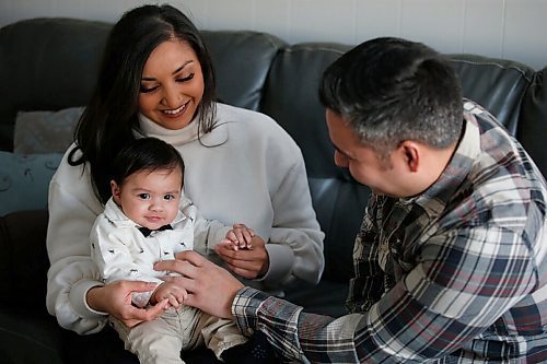 JOHN WOODS / WINNIPEG FREE PRESS
Andrea Tiwari and her fiancé Nelson Salazar are photographed with their four month old son Louie in their home in Winnipeg Tuesday, February 2, 2021. Tiwari, who is chef/owner of Bindys Caribbean Delights, had a baby and saw her father die during the pandemic.

Reporter: Zoratti