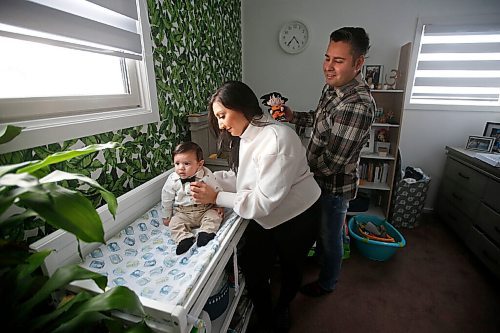 JOHN WOODS / WINNIPEG FREE PRESS
Andrea Tiwari and her fiancé Nelson Salazar are photographed with their four month old son Louie in their home in Winnipeg Tuesday, February 2, 2021. Tiwari, who is chef/owner of Bindys Caribbean Delights, had a baby and saw her father die during the pandemic.

Reporter: Zoratti