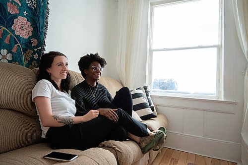 MIKE SUDOMA / WINNIPEG FREE PRESS
Meghan Malcolm (left) and Alice Charles (right) relax on the couch in their home Wednesday afternoon. The couple had just started dating when the first round of Covid 19 hit Manitoba last March. 
February 3, 2021