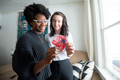 MIKE SUDOMA / WINNIPEG FREE PRESS
Meghan Malcolm (right) and Alice Charles (left) hold up a Valentines Day decoration that Meghans 5 year old daughter had made them.
February 3, 2021