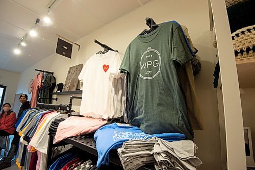 MIKE SUDOMA / WINNIPEG FREE PRESS
We Heart WPG T-Shirts hang among the racks as a Manitoba art piece hangs on the wall
February 3, 2021