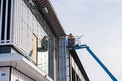 MIKE SUDOMA / WINNIPEG FREE PRESS
A worker works on the old Sears store space at Polo Park  Friday afternoon
February 5, 2021