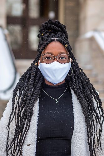 MIKAELA MACKENZIE / WINNIPEG FREE PRESS

Oluwadamilola (Dami) Ojo, whos started a group called Melan Unify for Black youth to connect with resources for professional development, poses for a portrait in front of St. Mary's Academy in Winnipeg on Friday, Feb. 5, 2021. For JS story.

Winnipeg Free Press 2021