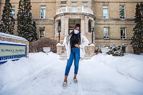 MIKAELA MACKENZIE / WINNIPEG FREE PRESS

Oluwadamilola (Dami) Ojo, whos started a group called Melan Unify for Black youth to connect with resources for professional development, poses for a portrait in front of St. Mary's Academy in Winnipeg on Friday, Feb. 5, 2021. For JS story.

Winnipeg Free Press 2021