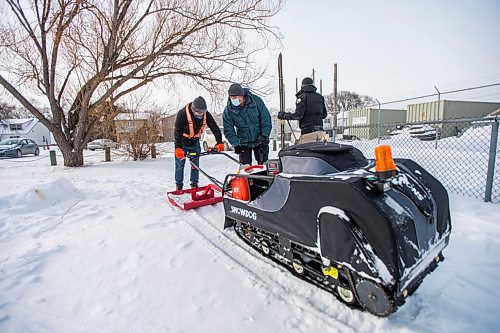 MIKAELA MACKENZIE / WINNIPEG FREE PRESS

Marlow Wilson shows Rylee Nepinak how to use the groomer as the team with Winnipeg Trails creates a ski trail around the field at the Minto Athletic Grounds in Winnipeg on Friday, Feb. 5, 2021. For JS story.

Winnipeg Free Press 2021